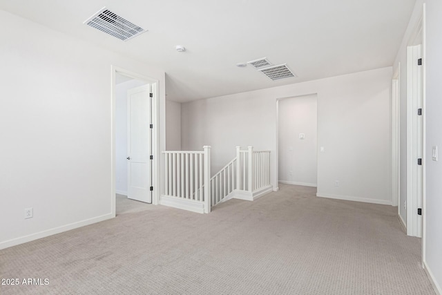 17322 W Puget Ave, Waddell, AZ 85355 - spare room featuring light colored carpet and a smoke detector