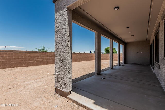 17322 W Puget Ave, Waddell, AZ 85355 - fenced backyard with a patio area