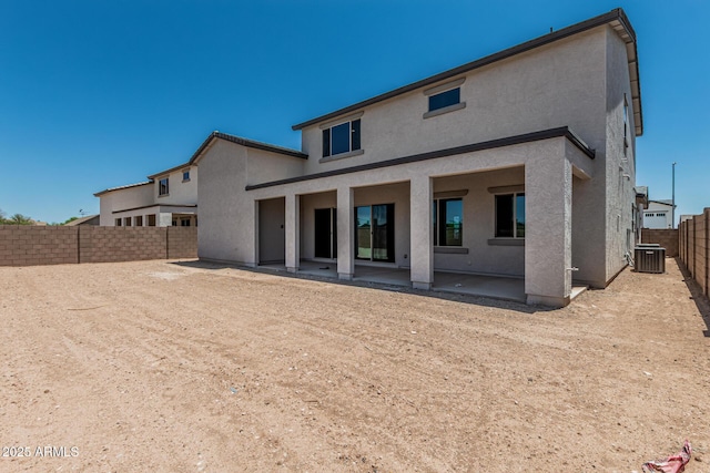 17322 W Puget Ave, Waddell, AZ 85355 - back of property featuring stucco siding, a patio area, and a fenced backyard