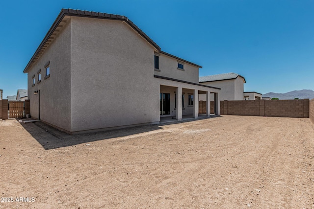 17322 W Puget Ave, Waddell, AZ 85355 - rear view of house featuring a patio area, a fenced backyard, and stucco siding