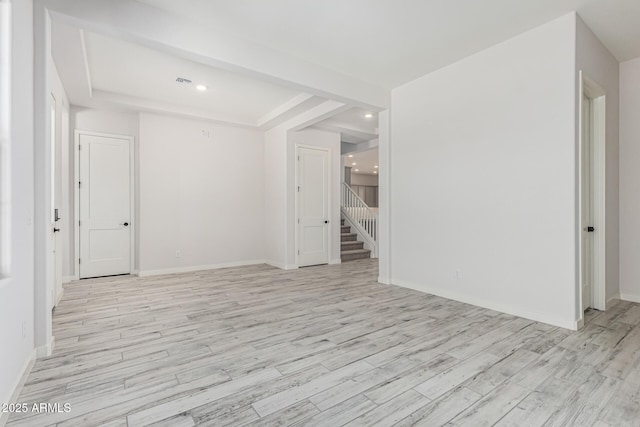 17322 W Puget Ave, Waddell, AZ 85355 - spare room with stairway, light wood finished floors, and recessed lighting