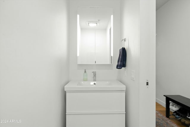 bathroom featuring vanity and hardwood / wood-style floors