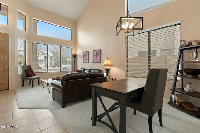 interior space featuring high vaulted ceiling and a chandelier