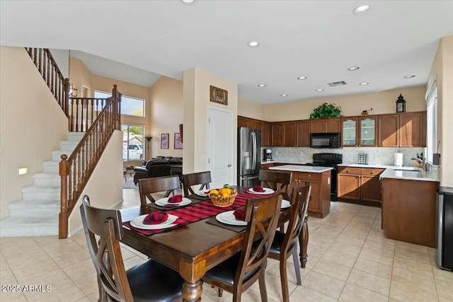 tiled dining room with sink