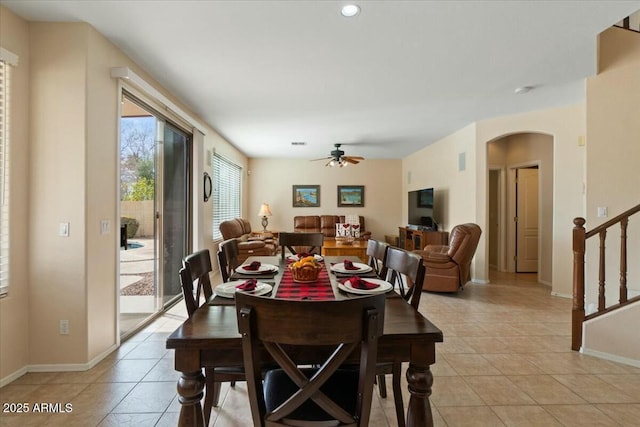 tiled dining area featuring ceiling fan