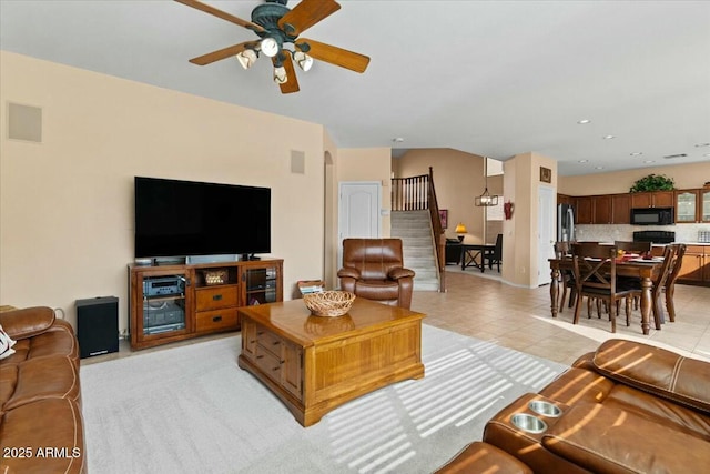 living room featuring ceiling fan and light tile patterned floors