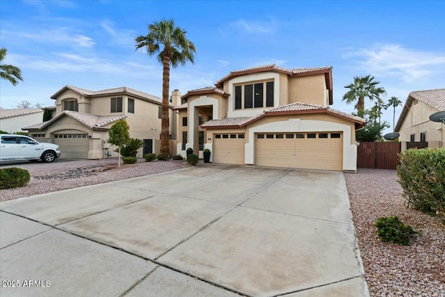 mediterranean / spanish house with a garage