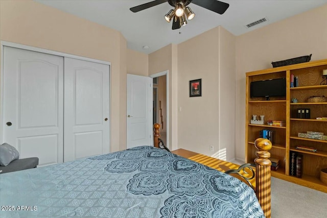 bedroom with ceiling fan and a closet