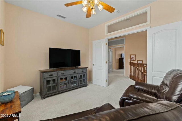 living room featuring carpet flooring and ceiling fan