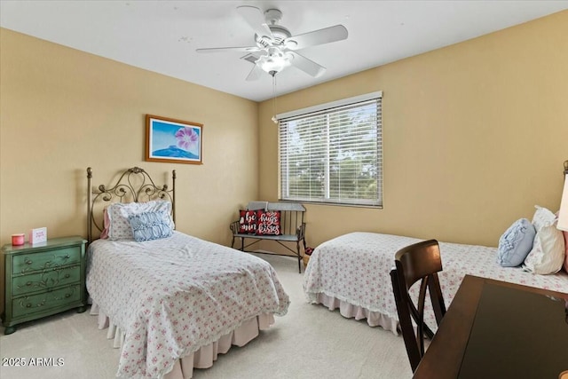 bedroom with ceiling fan and light colored carpet