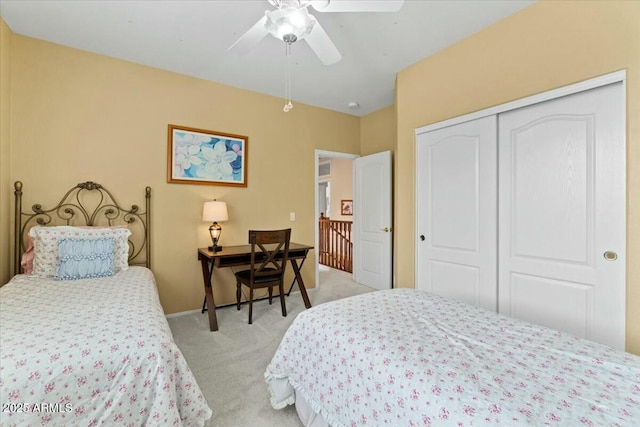 bedroom with light carpet, a closet, and ceiling fan