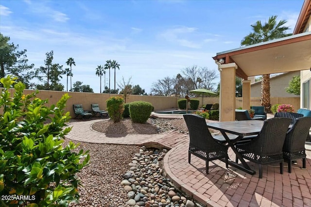 view of patio / terrace with a jacuzzi