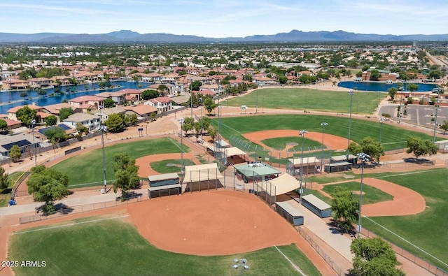 aerial view featuring a water and mountain view