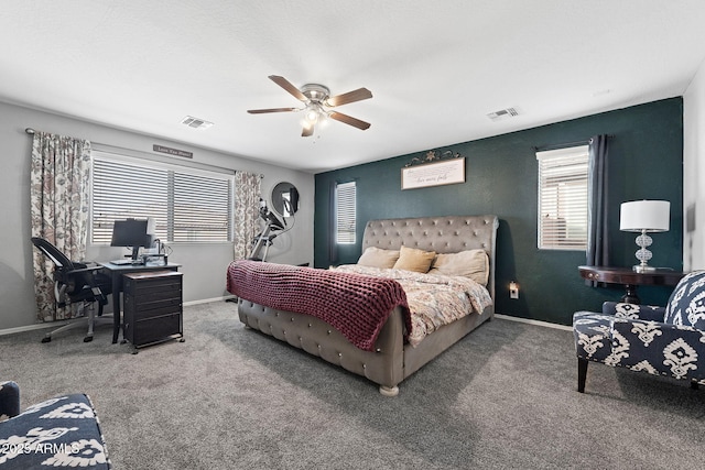 bedroom with carpet floors, visible vents, and baseboards