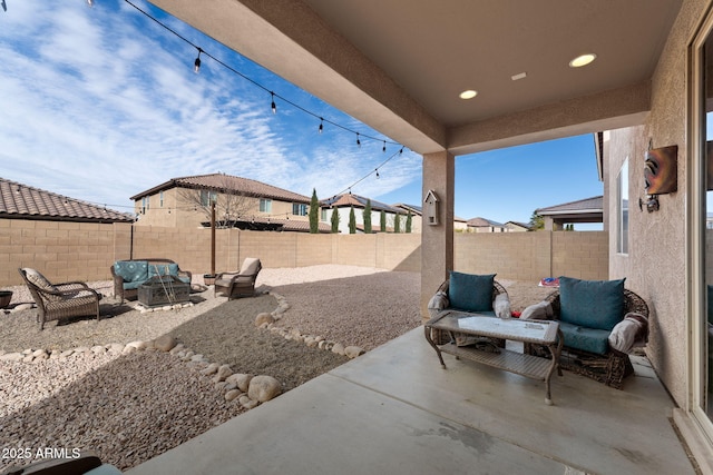 view of patio / terrace featuring outdoor lounge area and a fenced backyard