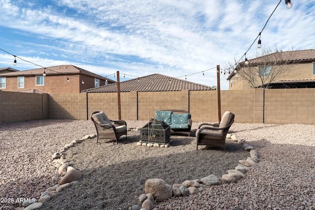 view of yard featuring a fenced backyard and outdoor lounge area