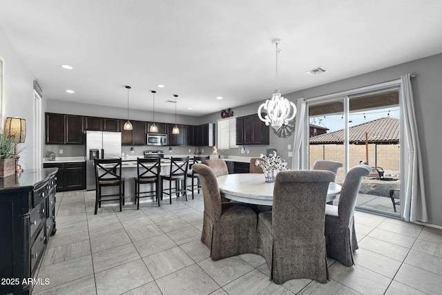 dining room featuring a chandelier, recessed lighting, visible vents, and light tile patterned floors