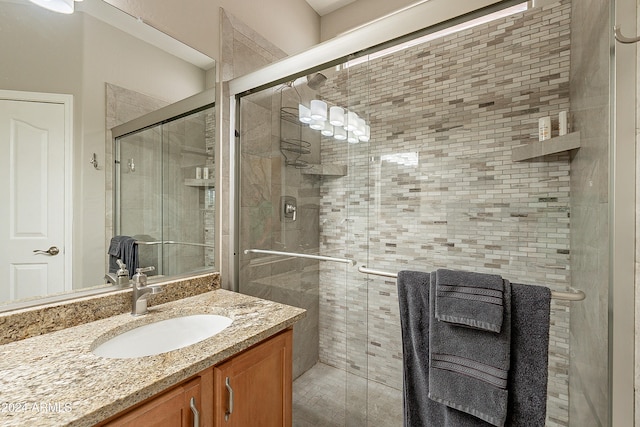 bathroom with vanity and an enclosed shower