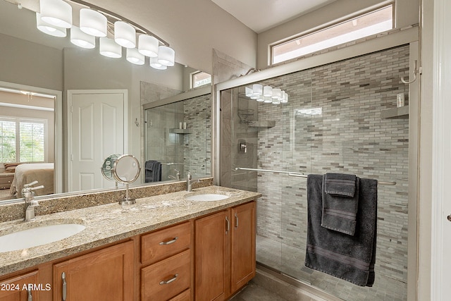 bathroom featuring vanity and an enclosed shower