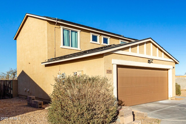 view of front of home with an outbuilding, a garage, and central air condition unit