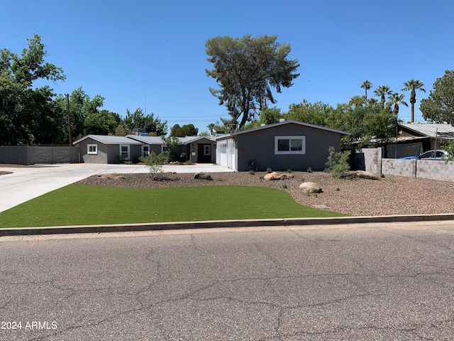 ranch-style home with a front lawn