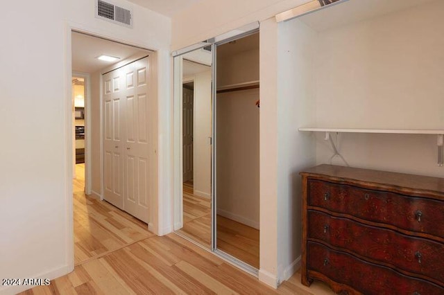 hallway featuring light wood-type flooring