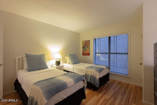 bedroom with wood-type flooring