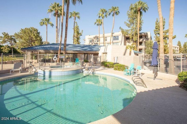 view of swimming pool featuring a patio