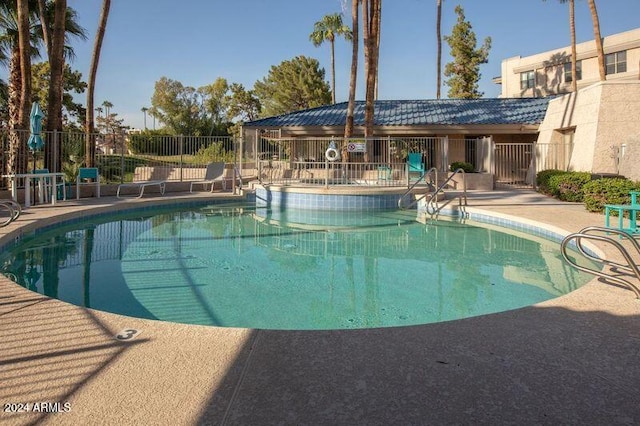 view of swimming pool featuring a patio