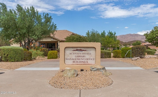 community sign featuring a mountain view