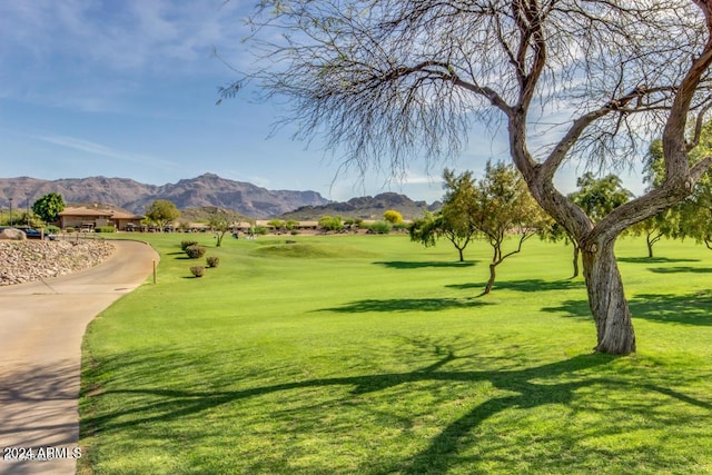 view of home's community featuring a yard and a mountain view