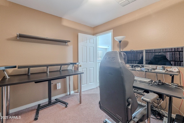 home office featuring baseboards, visible vents, and carpet