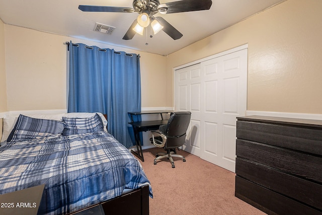 bedroom with a closet, baseboards, ceiling fan, visible vents, and carpet floors