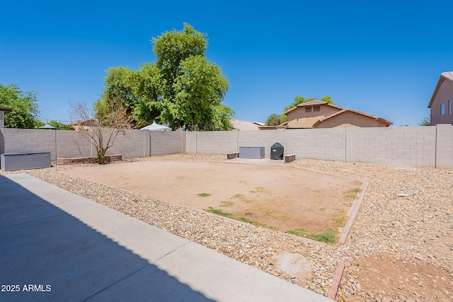 view of yard with a patio area and a fenced backyard