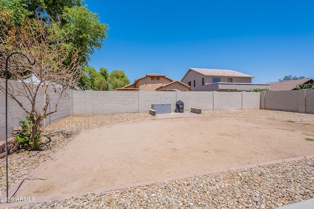 view of yard with a fenced backyard and a patio