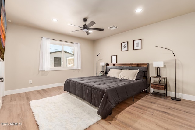 bedroom featuring light hardwood / wood-style floors and ceiling fan