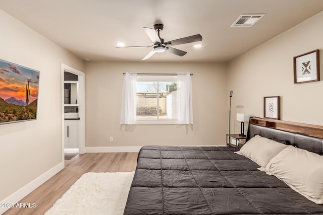 bedroom with hardwood / wood-style flooring and ceiling fan