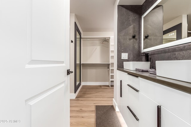 bathroom featuring vanity and hardwood / wood-style floors