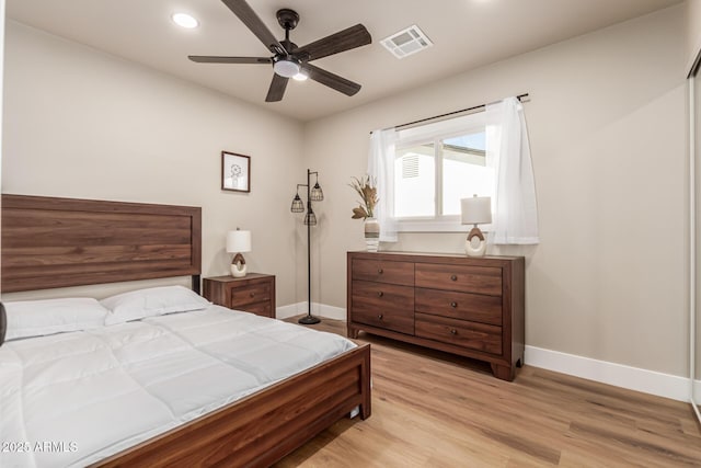 bedroom featuring ceiling fan and light wood-type flooring