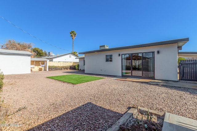 back of property with cooling unit and a patio area