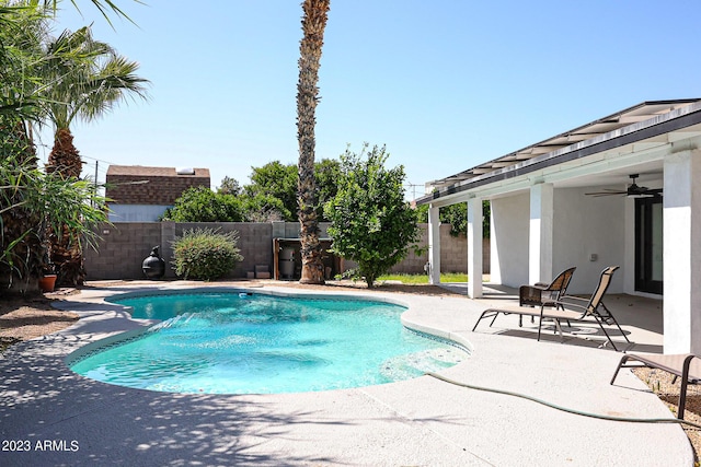 view of pool featuring ceiling fan, a fenced in pool, a fenced backyard, and a patio area