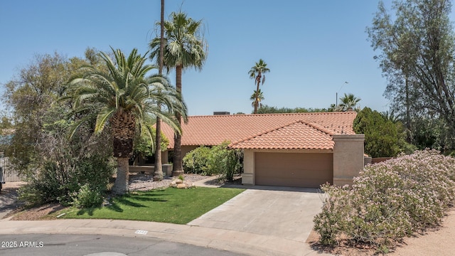 6101 E Beck Ln, Scottsdale, AZ 85254 - view of front facade with a tiled roof, stucco siding, an attached garage, concrete driveway, and a front yard