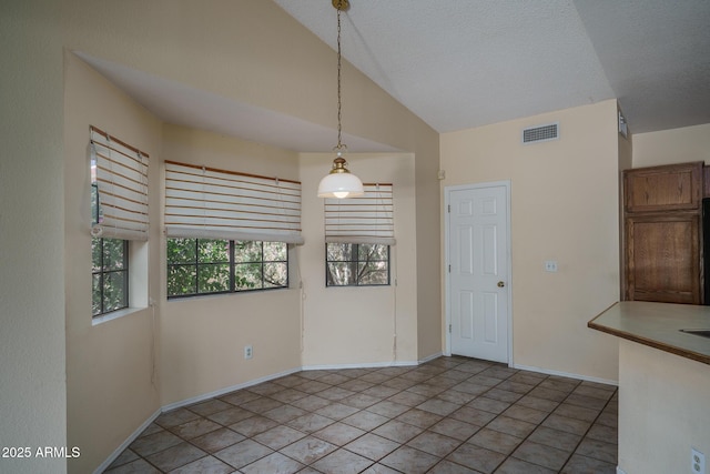 6101 E Beck Ln, Scottsdale, AZ 85254 - unfurnished dining area with baseboards and high vaulted ceiling