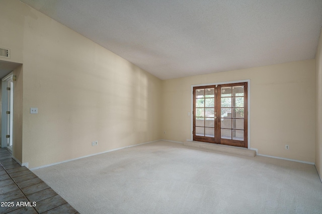 6101 E Beck Ln, Scottsdale, AZ 85254 - empty room with french doors and carpet flooring