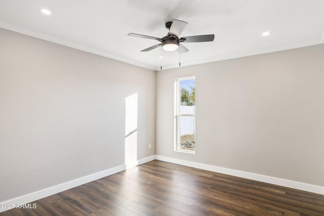 empty room featuring ceiling fan, crown molding, and dark hardwood / wood-style floors