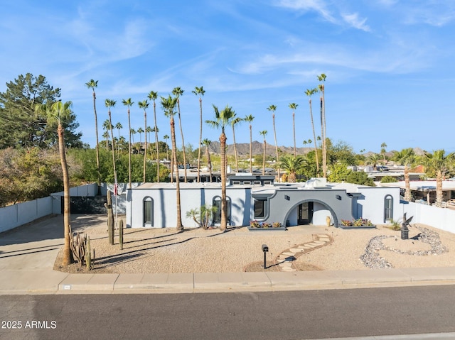 view of front of property with a mountain view