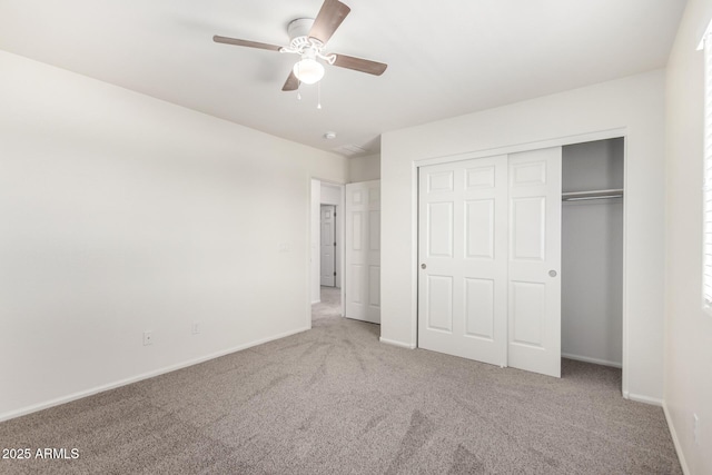unfurnished bedroom featuring a ceiling fan, baseboards, carpet, and a closet