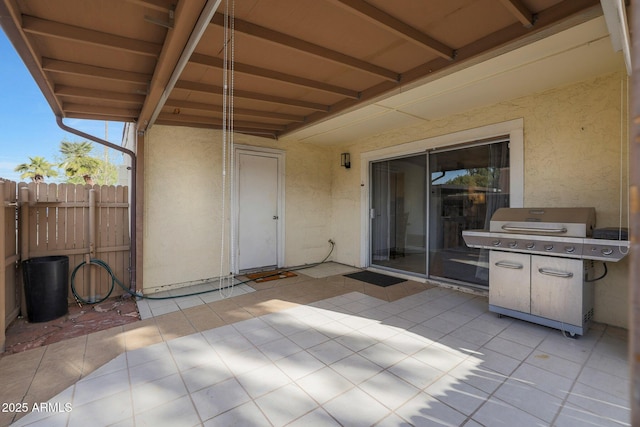 view of patio featuring a grill