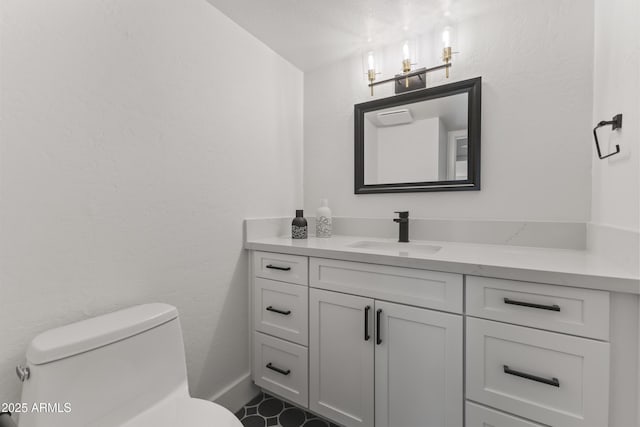 bathroom with vanity and toilet