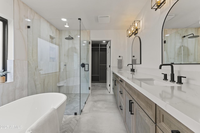 bathroom with vanity and independent shower and bath